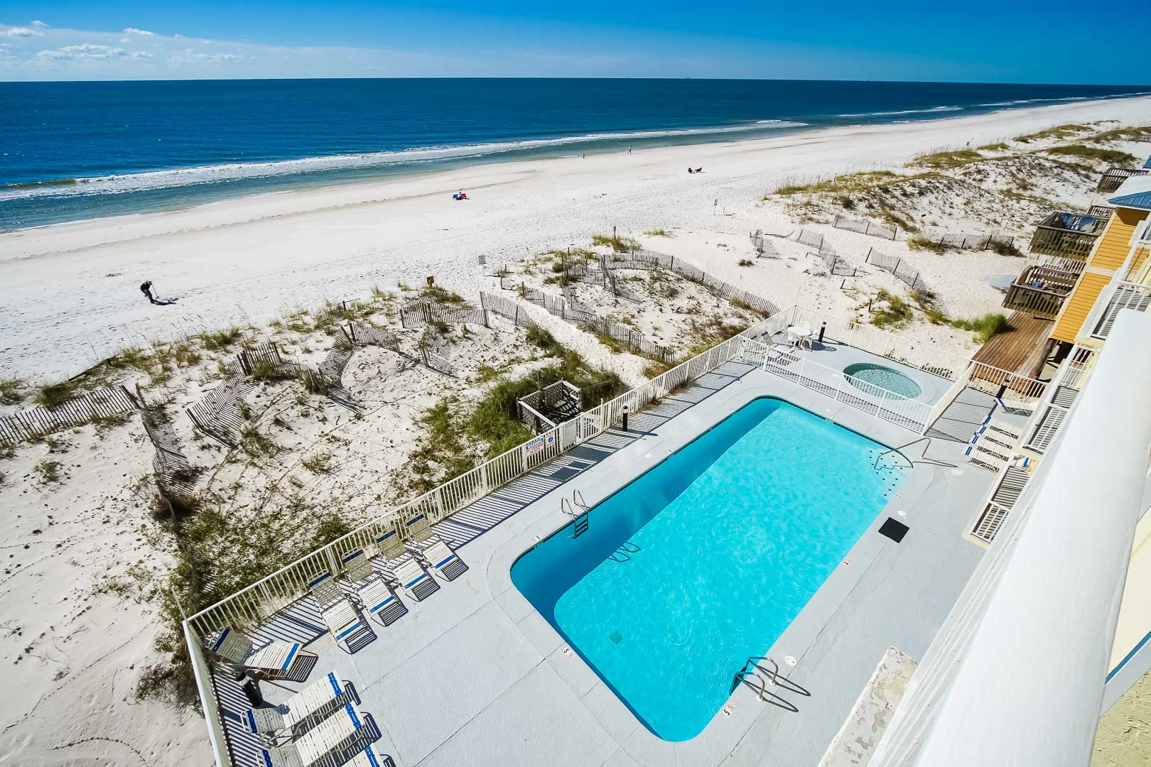 A crisp swimming pool next to the beach at VRI's Shoreline Towers in Gulf Shores, Alabama.